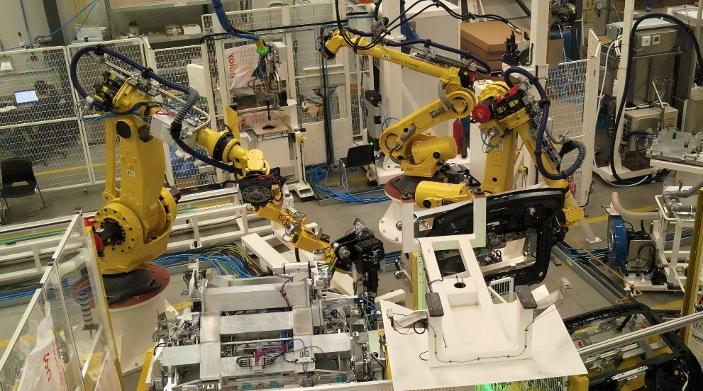 Multi-robot bonding cell: handling, adhesive application and flame treatment inside one cycle.